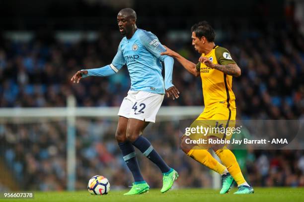 Yaya Toure of Manchester City and Leonardo Ulloa of Brighton & Hove Albion during the Premier League match between Manchester City and Brighton and...