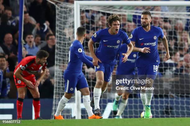 Marcos Alonso of Chelsea celebrates after scoring his sides first goal during the Premier League match between Chelsea and Huddersfield Town at...