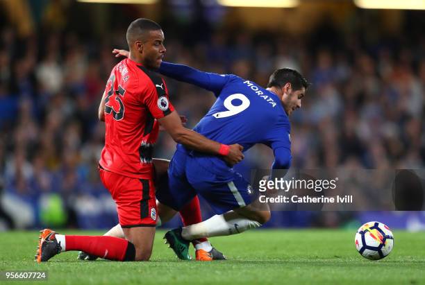 Alvaro Morata of Chelsea is challenged by Mathias Jorgensen of Huddersfield Town during the Premier League match between Chelsea and Huddersfield...