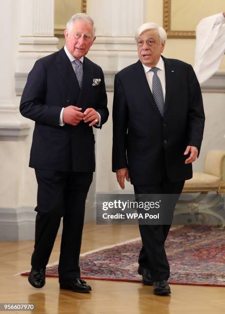Prince Charles, Prince of Wales speaks with the President of Greece Prokopis Pavlopoulos as they arrive for an Official Dinner at the Presidential...