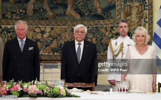 Prince Charles, Prince of Wales, President of Greece Prokopis Pavlopoulos and Camilla, Duchess of Cornwall stand for the anthem during an Official...