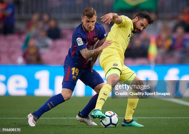 Lucas Digne of Barcelona competes for the ball with Mario Gaspar of Villerral during the La Liga match between Barcelona and Villarreal at Camp Nou...