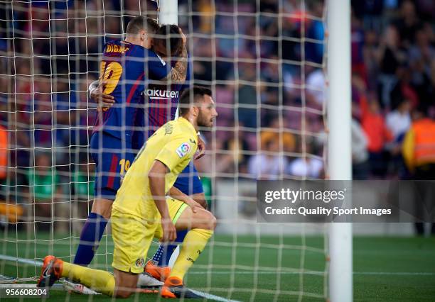 Lucas Digne and Paulinho Bezerra of Barcelona celebrates a goal during the La Liga match between Barcelona and Villarreal at Camp Nou on May 9, 2018...