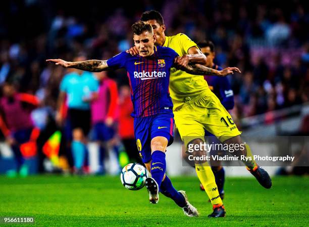 Lucas Digne of Barcelona battles for the ball with Rodri Hernandez of Villarreal during the La Liga match between FC Barcelona and Villarreal CF at...