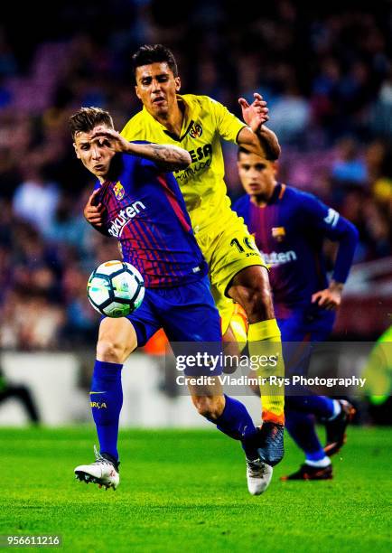 Lucas Digne of Barcelona battles for the ball with Rodri Hernandez of Villarreal during the La Liga match between FC Barcelona and Villarreal CF at...