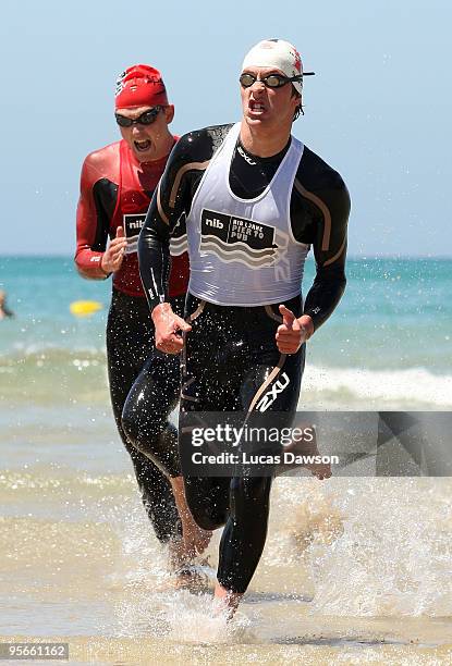 Elite Open Winner Sam Sheppard runs out of the water before winning the Lorne Pier to Pub at Main Beach Lorne on January 9, 2010 in Lorne, Australia.