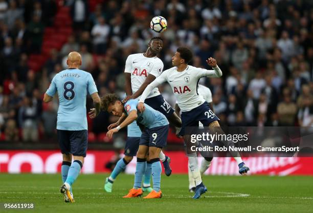 Tottenham Hotspur's Victor Wanyama and Dele Alli challenge Newcastle United's Dwight Gayle during the Premier League match between Tottenham Hotspur...