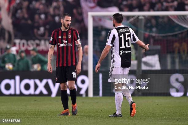 Leonardo Bonucci of Milan talks with Andrea Barzagli of Juventus during the TIM Cup - Coppa Italia final match between Juventus and AC Milan at...