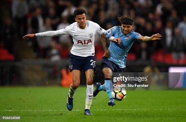 Dele Alli of Tottenham Hotspur battles for possession with Deandre Yedlin of Newcastle United during the Premier League match between Tottenham...