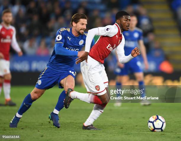 Ainsley Maitland-Niles of Arsenal challenged by Adrien Silva of Leicester during the Premier League match between Leicester City and Arsenal at The...