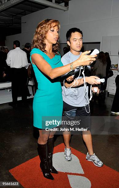 Actress Shaun Robinson and EA Sports representative Gerard Recio attend the EA Sports Active and Nancy O'Dell "Active For Life" benefit for The March...