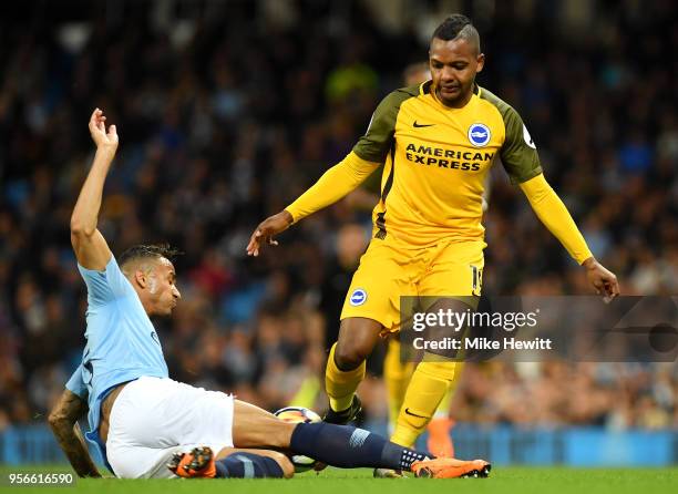 Jose Izquierdo of Brighton and Hove Albion is tackled by Danilo of Manchester City during the Premier League match between Manchester City and...