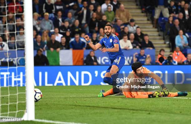 Riyad Mahrez of Leicester City scores his sides third goal past Petr Cech of Arsenal during the Premier League match between Leicester City and...