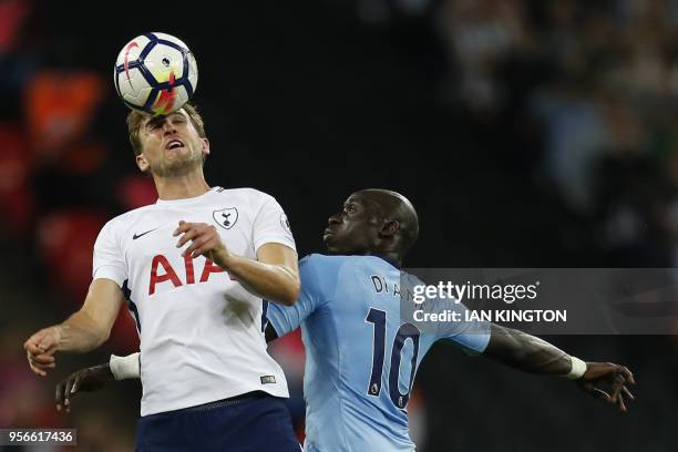 Tottenham Hotspur's English striker Harry Kane vies with Newcastle United's Senegalese midfielder Mohamed Diame during the English Premier League...