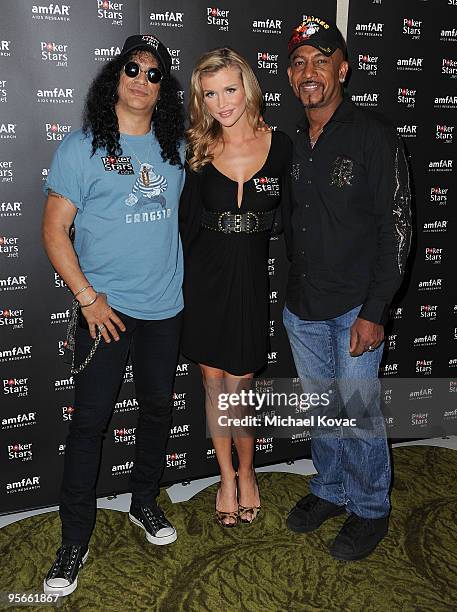 Musician Slash, TV personality Joanna Krupa and Montel Williams attend the amfAR & Pokerstars Celebrity Charity Poker Tournament at Atlantis Paradise...