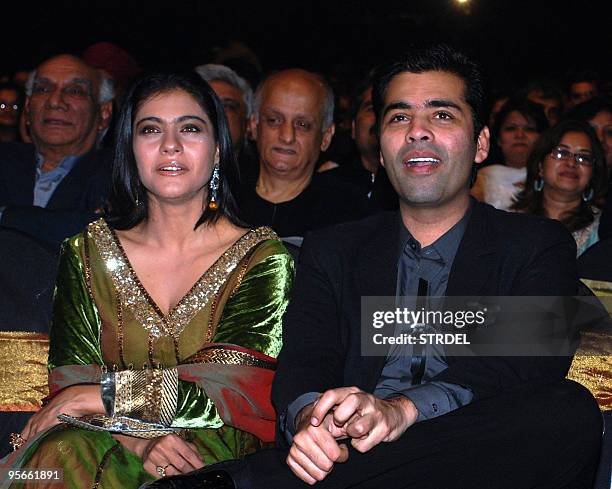 Indian Bollywood actress Kajol Devgan and director Karan Johar attend an awards ceremony in Mumbai late January 8, 2010. AFP PHOTO/STR