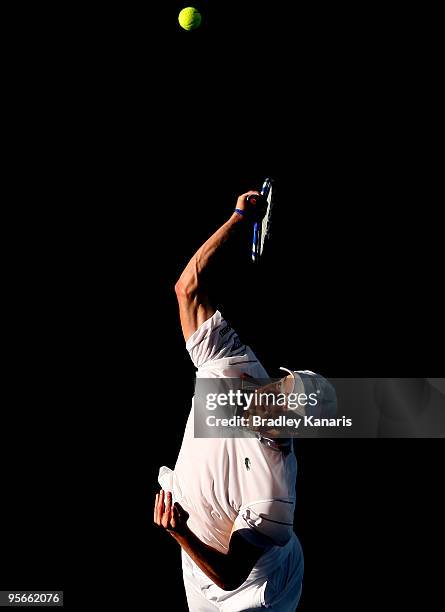 Andy Roddick of the USA playing with James Blake of the USA serves in his doubles semi-final match against Jeremy Chardy of France playing with Marc...