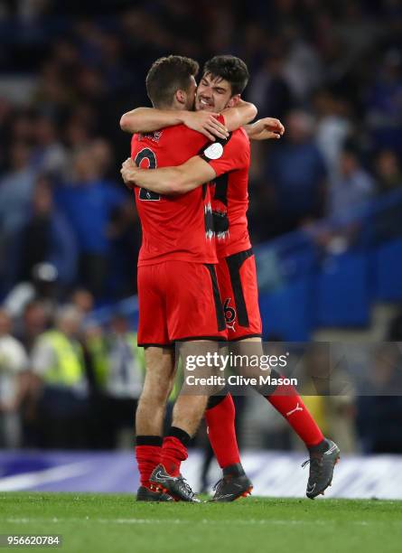 Jack Payne of Huddersfield Town and Tommy Smith of Huddersfield Town embrace after the Premier League match between Chelsea and Huddersfield Town at...