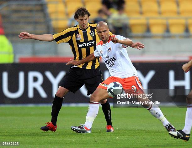 Sergio Van Dijk of the Roar holds off Jonathan McKain of the Phoenix during the round 22 A-League match between the Wellington Phoenix and the...