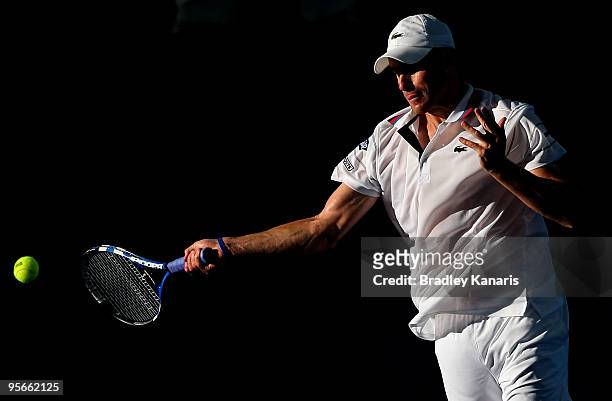 Andy Roddick of the USA playing with James Blake of the USA plays a forehand in his mens doubles semi-final match against Marc Gicquel of France...