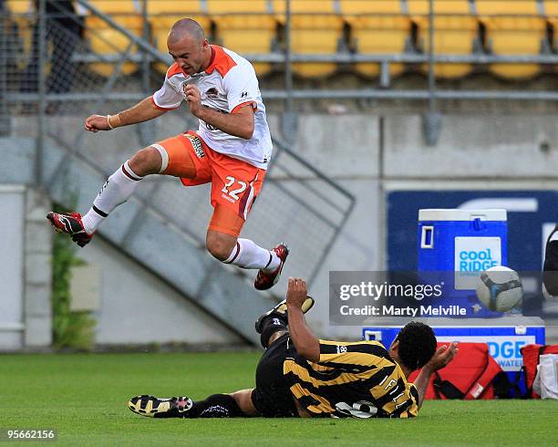 Ivan Franjic of the Roar jumps over Paul Ifill of the Phoenix during the round 22 A-League match between the Wellington Phoenix and the Brisbane Roar...