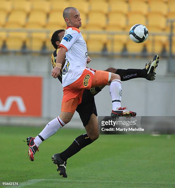 Ivan Franjic of the Roar jumps for the ball with Paul Ifill of the Phoenix during the round 22 A-League match between the Wellington Phoenix and the...