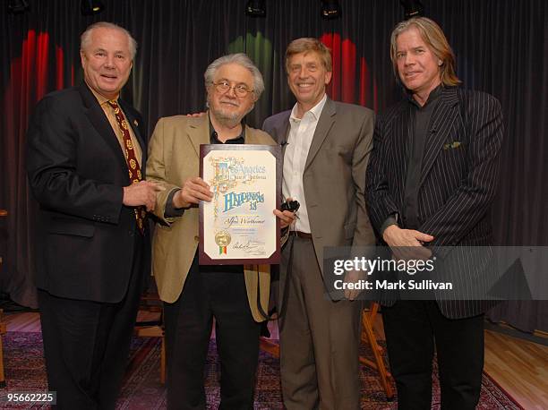 Los Angeles city councilmember Tom LaBonge presents photographer Alfred Wertheimer with a city proclamation with GRAMMY Museum executive director,...