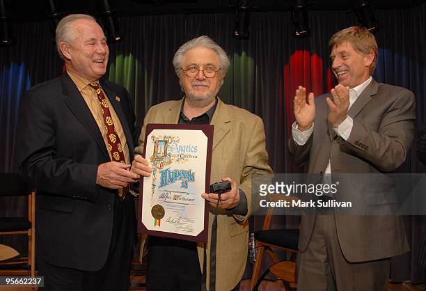 Los Angeles city councilmember Tom LaBonge presents photographer Alfred Wertheimer with a city proclamation with GRAMMY Museum executive director,...