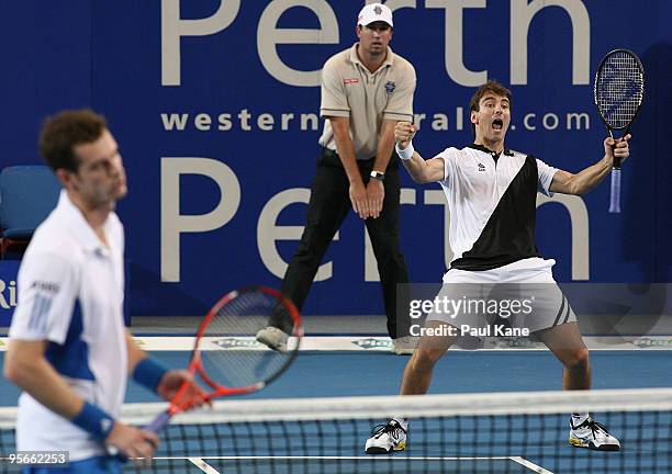 Tommy Robredo of Spain celebrates defeating Laura Robson and Andy Murray of Great Britain in the final between Great Britain and Spain during day...