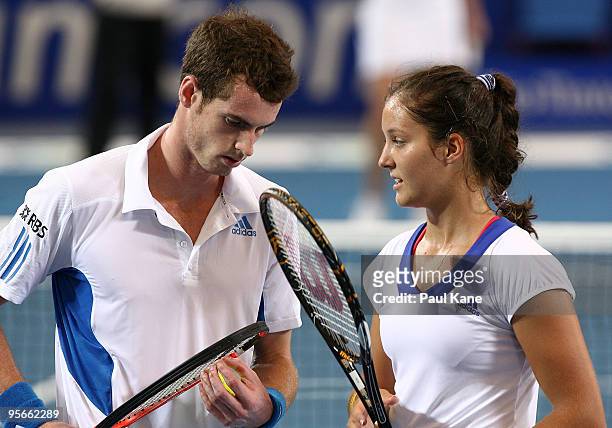 Andy Murray and Laura Robson of Great Britain talk tactics in the mixed doubles finals match against Maria Jose Martinez Sanchez and Tommy Robredo of...