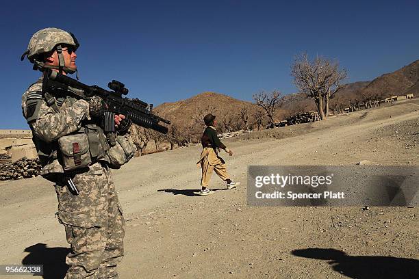 Sgt. Kurt Gallina, a US Army soldier with a Provincial Reconstruction Team , stands on patrol on January 9, 2010 in Pushtay, Afghanistan. Soldiers,...