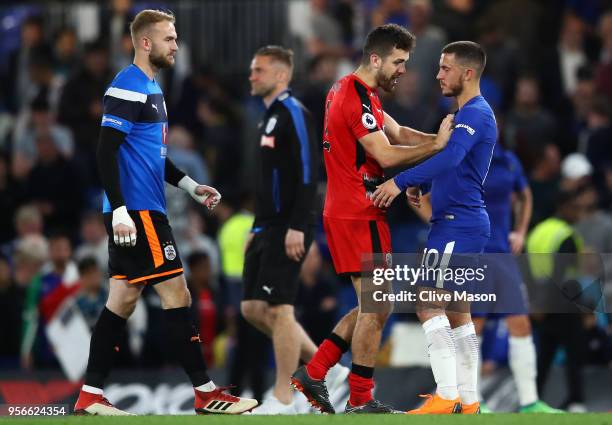 Christopher Schindler of Huddersfield Town speaks with Eden Hazard of Chelsea after the Premier League match between Chelsea and Huddersfield Town at...