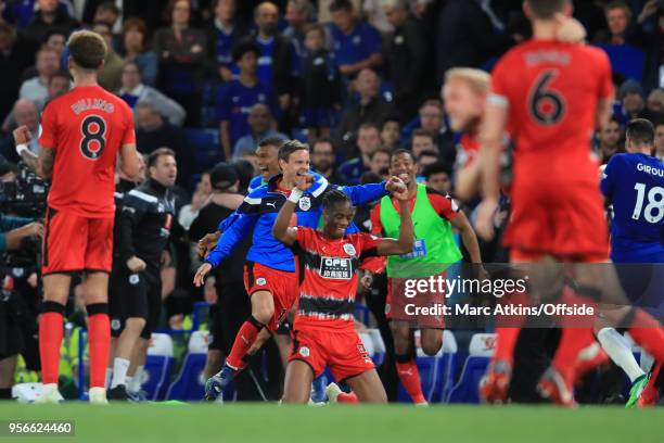 Huddersfield Town players celebrate Premier League survival during the Premier League match between Chelsea and Huddersfield Town at Stamford Bridge...