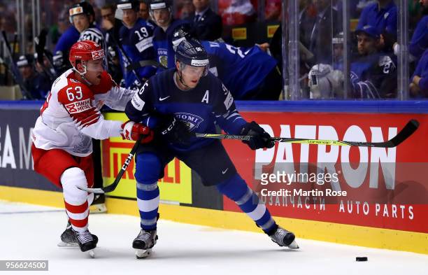 Mikko Rantanen of Finland and Patrick Russell of Denmark battle for the puck during the 2018 IIHF Ice Hockey World Championship group stage game...
