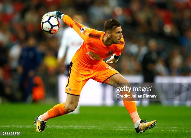 Martin Dubravka of Newcastle United rolls the ball out during the Premier League match between Tottenham Hotspur and Newcastle United at Wembley...