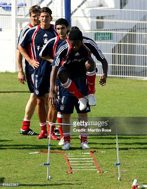 David Alaba of Bayern Muenchen jumps during the FC Bayern Muenchen training session at the Al Nasr training ground on January 9, 2010 in Dubai,...