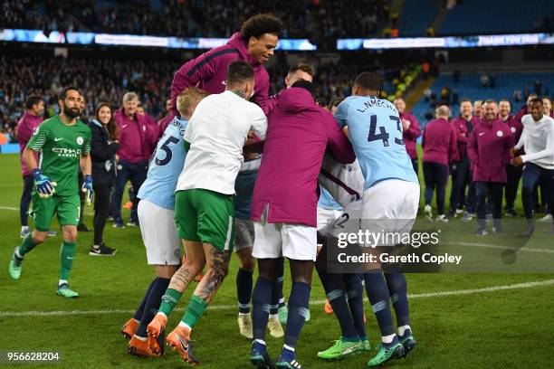 Yaya Toure of Manchester City is jumped on by his teammates after the Premier League match between Manchester City and Brighton and Hove Albion at...