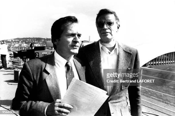 Portrait du journaliste Philippe Labro et de l'acteur américain Charlton Heston au Festival du Film Américain en septembre 1982 à Deauville, France.