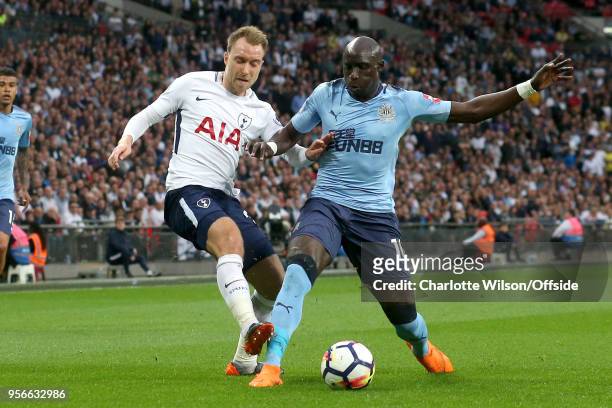 Mohamed Diame of Newcastle stretches to block Christian Eriksen of Tottenham during the Premier League match between Tottenham Hotspur and Newcastle...