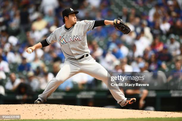 Junichi Tazawa of the Miami Marlins throws a pitch during the fourth inning of a game against the Chicago Cubs at Wrigley Field on May 9, 2018 in...