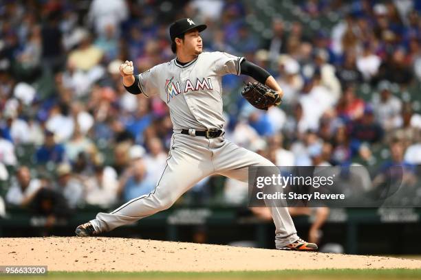 Junichi Tazawa of the Miami Marlins throws a pitch during the fourth inning of a game against the Chicago Cubs at Wrigley Field on May 9, 2018 in...