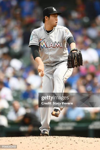 Junichi Tazawa of the Miami Marlins throws a pitch during the fourth inning of a game against the Chicago Cubs at Wrigley Field on May 9, 2018 in...