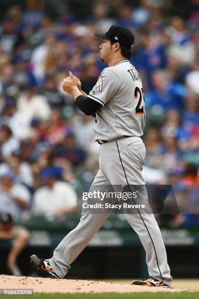 Junichi Tazawa of the Miami Marlins throws a pitch during the fourth inning of a game against the Chicago Cubs at Wrigley Field on May 9, 2018 in...
