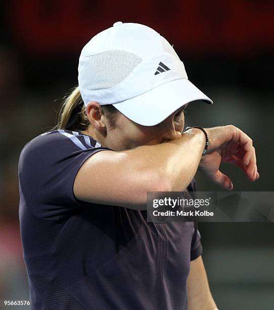 Justine Henin of Belgium reacts after losing a point in the Women's final against Kim Clijsters of Belgium during day seven of the Brisbane...