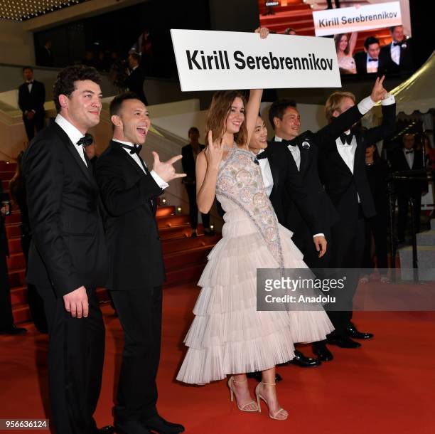 Actress Irina Starshenbaum holds a sign with the name of the banned director Kirill Serebrennikov as she poses with producer Charles-Evrard Tchekhoff...