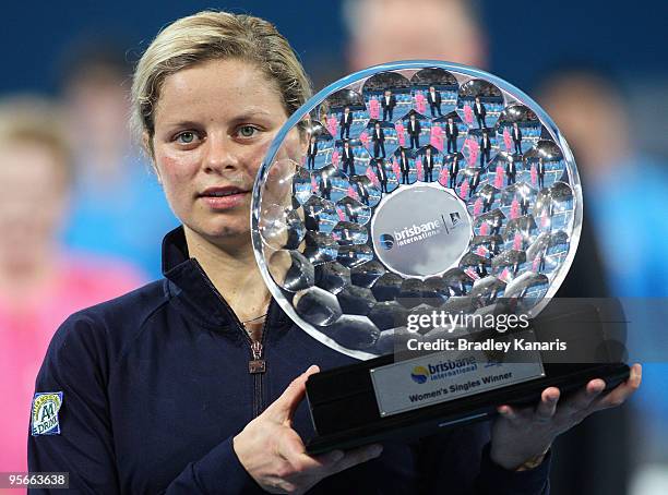 Kim Clijsters of Belgium poses with the trophy after winning the Womens final match against Justine Henin of Belgium during day seven of the Brisbane...