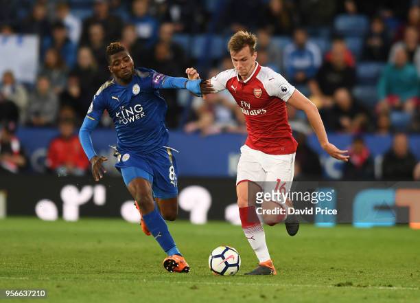 Rob Holding of Arsenal takes Kelechi Iheanacho of Leicester during the Premier League match between Leicester City and Arsenal at The King Power...