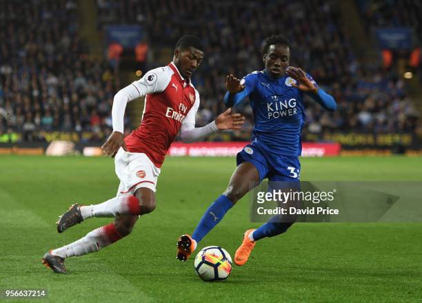 Ainsley Maitland-Niles of Arsenal takes Fousseni Diabate of Leicester during the Premier League match between Leicester City and Arsenal at The King...