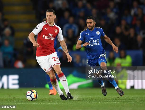 Granit Xhaka of Arsenal takes on Rihad Mahrez of Leicester during the Premier League match between Leicester City and Arsenal at The King Power...