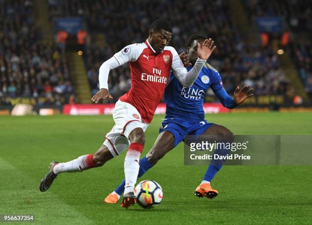 Ainsley Maitland-Niles of Arsenal takes Fousseni Diabate of Leicester during the Premier League match between Leicester City and Arsenal at The King...